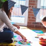 Mom and toddler playing mix and match puzzle together