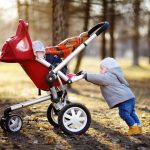 toddler pushing one of the best strollers under $200